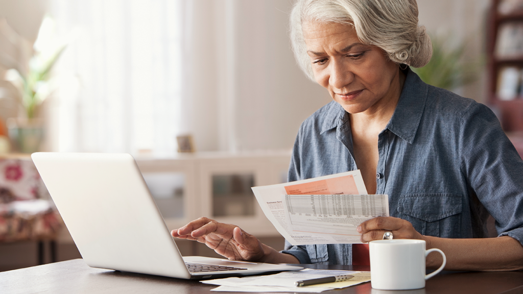 Woman filing a claim on a computer