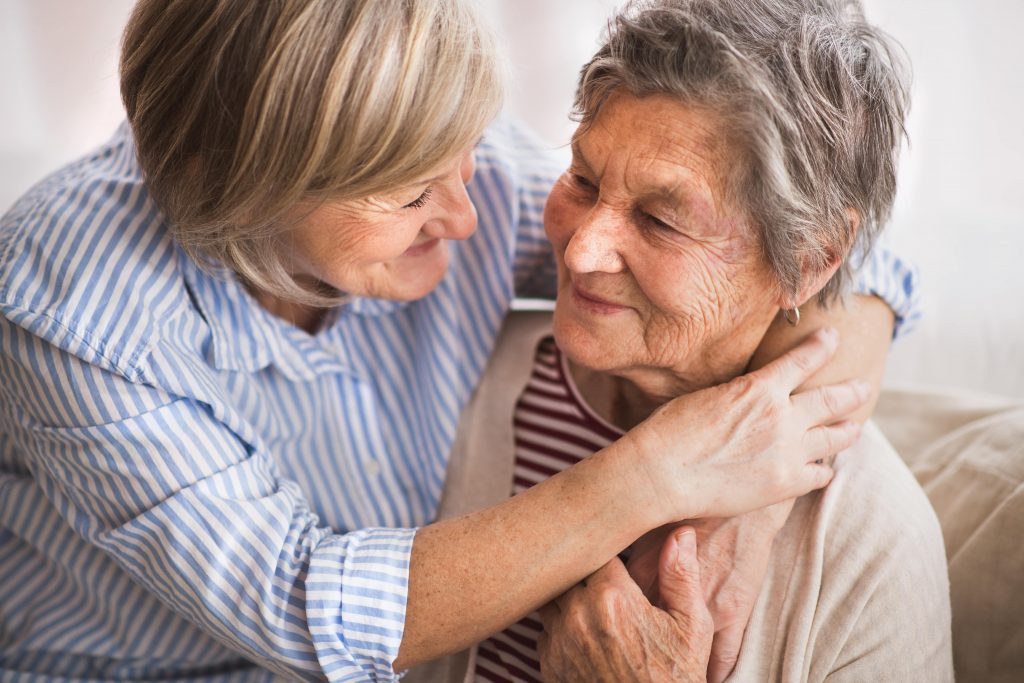 Elderly couple filing out forms